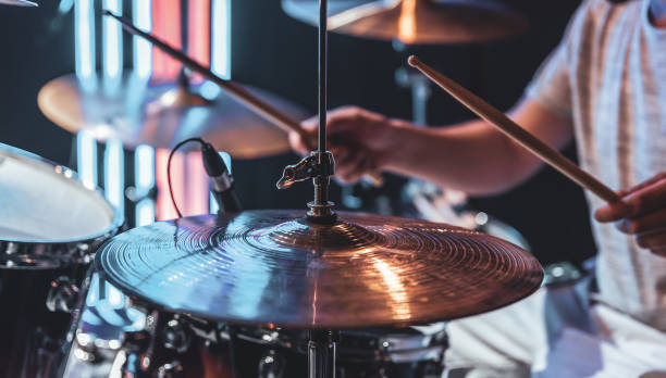 istock Close-up of a drummer playing a drum cymbal on a blurred background. 1333264031