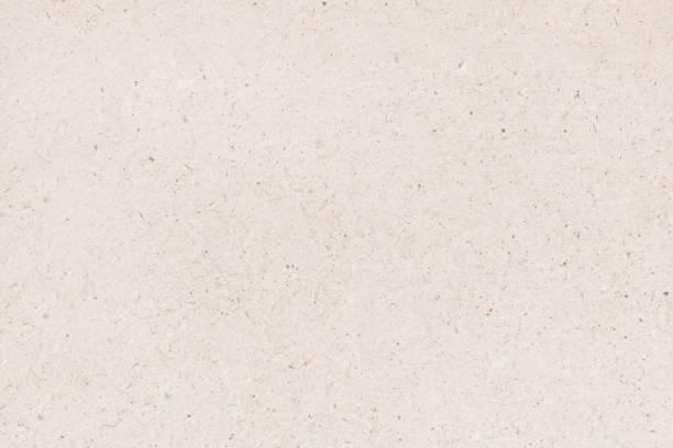 istock A sheet of hardboard covered with small dots, scratches and inclusions. 1333265632