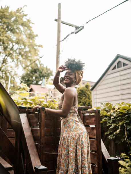 istock Young African woman relaxing in back yard 1333265942