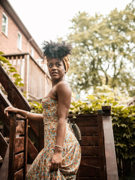 istock Young African woman relaxing in back yard 1333266463
