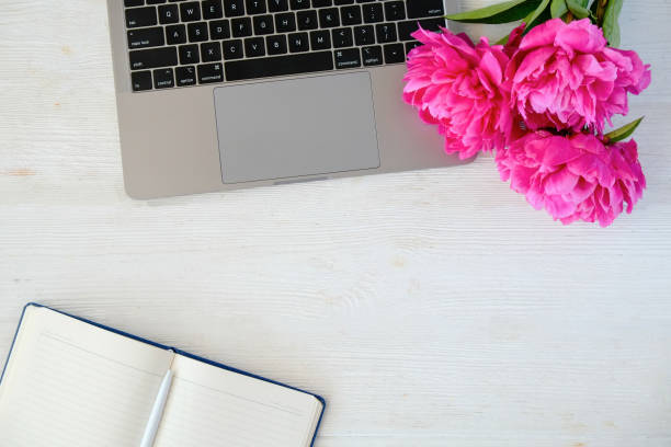 istock Flat lay with flowers and laptop 1333266585