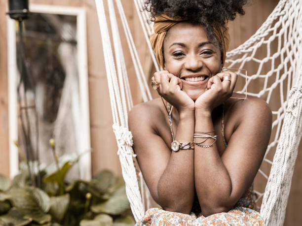 istock Young African woman relaxing in back yard 1333266624
