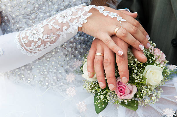 istock Hands and rings on wedding bouquet 133326797