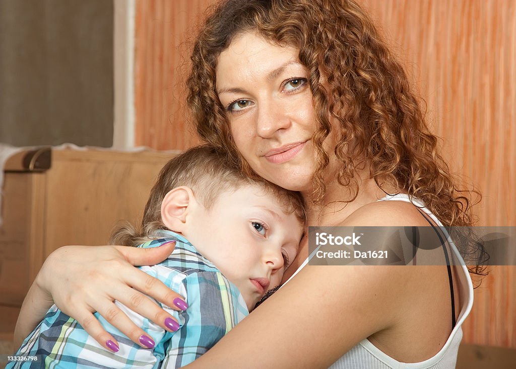 Mother holding her son. Mother comforting four year old son Consoling Stock Photo