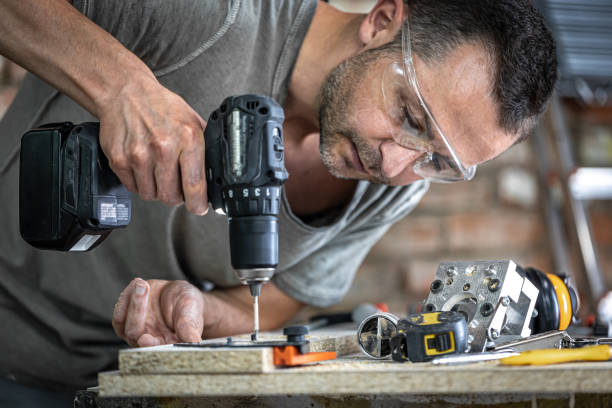 A professional carpenter uses wood screws, screws. stock photo