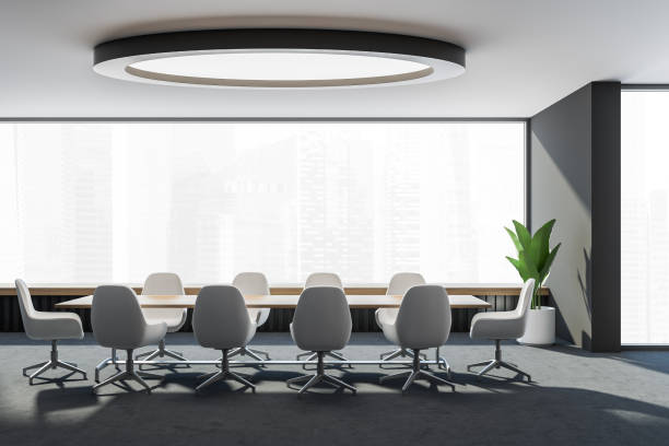 istock Modern meeting room with white office chairs in panoramic space 1333268762