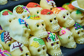 Set of sugar skulls in the market. Day of the Dead concept. Día de Muertos, Calaveritas de Azúcar.