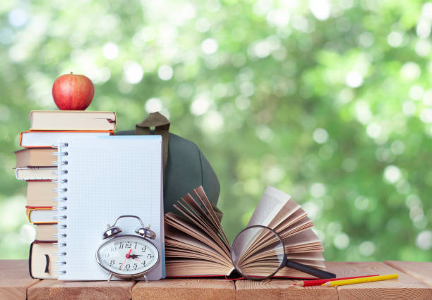 istock Education background with chalkboard and books on the nature 1333272353