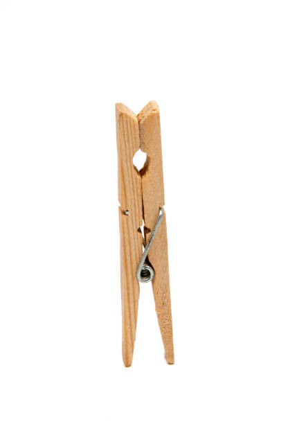 istock wooden clothes pegs isolated on the white 1333272998