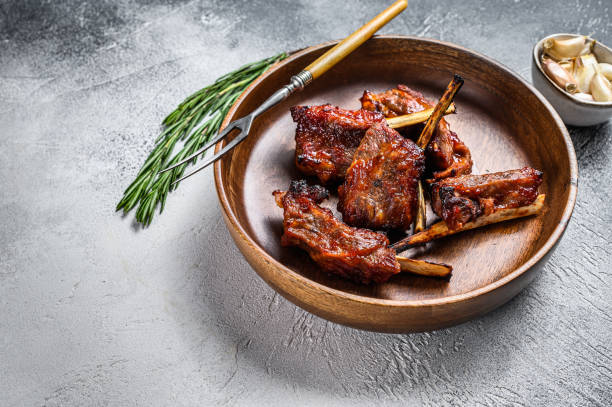 istock BBQ grilled sliced lamb short spare loin ribs. White background. Top view. Copy space 1333274981
