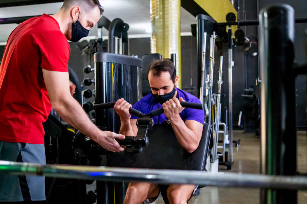 istock Man and his instructor at the gym 1333278189
