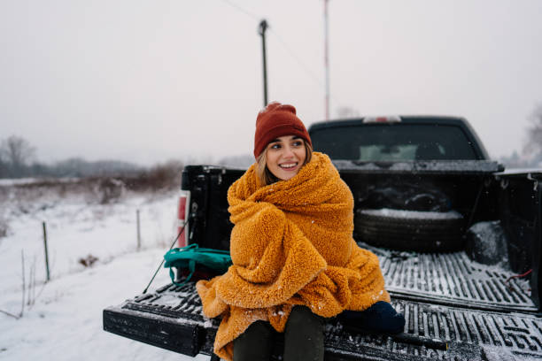istock Young woman on a winter road trip 1333279156