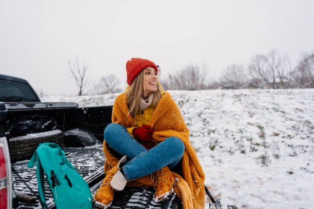 istock Young woman on a winter road trip 1333279191