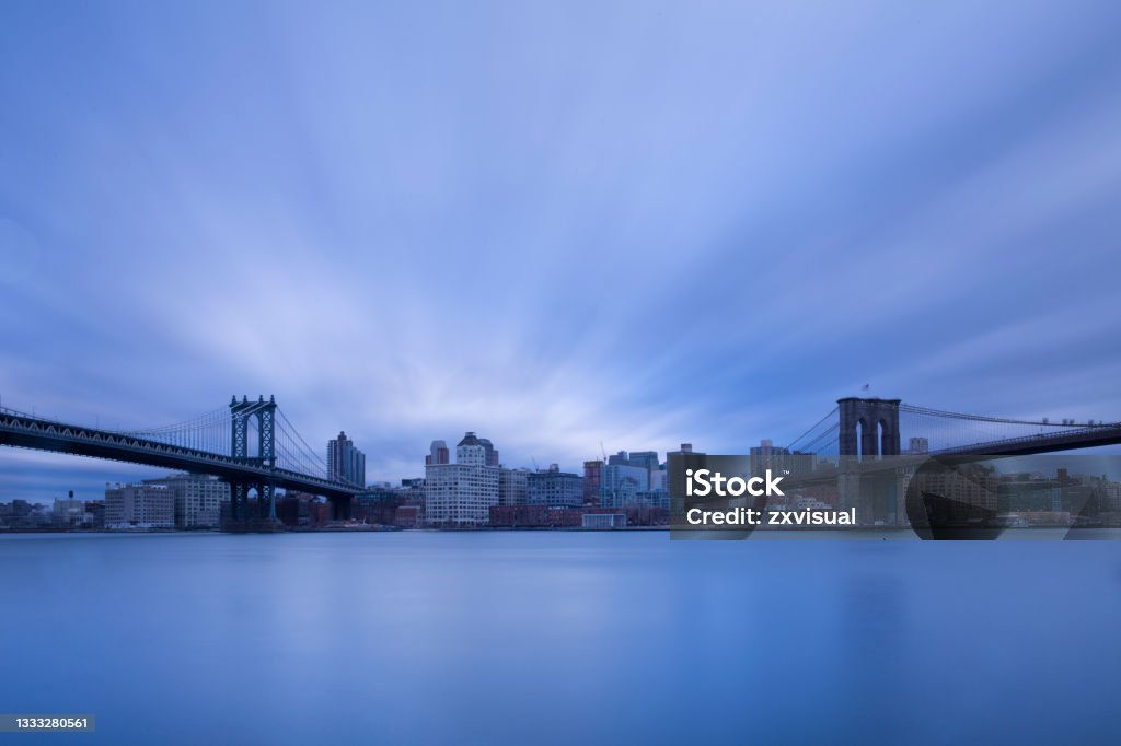 Two Bridges Manhattan and Brooklyn Bridge long exposure. Brooklyn - New York Stock Photo