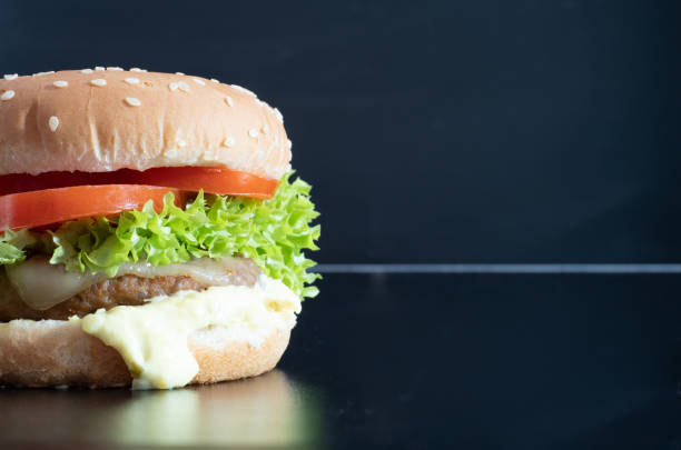 istock Hamburger on a wooden background. View from above 1333285105