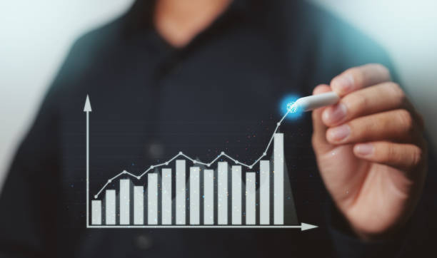 istock Businessman showing business growth on a chart with pen, hands touch the graph that represents profit rises on a lot more. 1333285249
