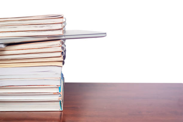 istock Laptop in a stack of books 1333288891
