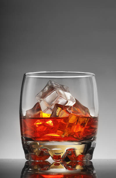 istock glass with alcohol and ice cubes 1333294114