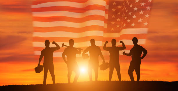istock Worker on the USA flag background . Labor day holiday concept. 1333295247