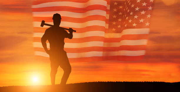 istock Worker on the USA flag background . Labor day holiday concept. 1333295253