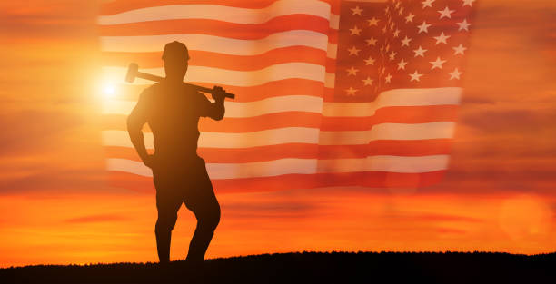 istock Worker on the USA flag background . Labor day holiday concept. 1333295267