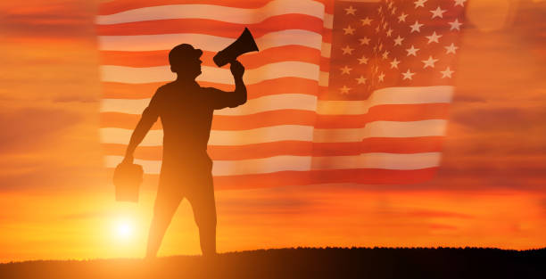 istock Worker on the USA flag background . Labor day holiday concept. 1333295270
