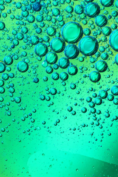 istock oil bubbles with water on glass 1333297102