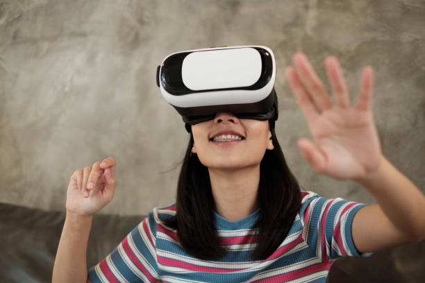 istock Asian woman with VR headset, watching the 3D virtual simulation. 1333310331