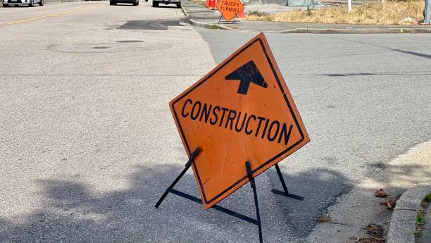 istock sign construction zone development ahead reduce speed traffic road repair maintenance 1333311962