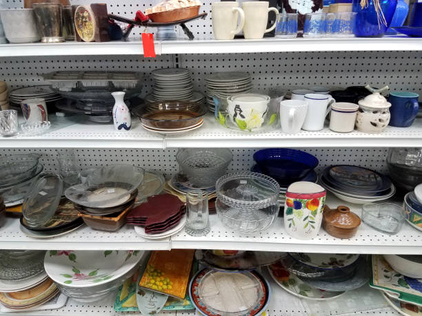 Thrift Store Dishes Shelves of Thrift store dishes second hand stock pictures, royalty-free photos & images