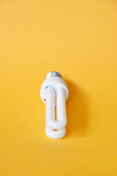 istock White color lamp isolated on yellow color background 1333312979