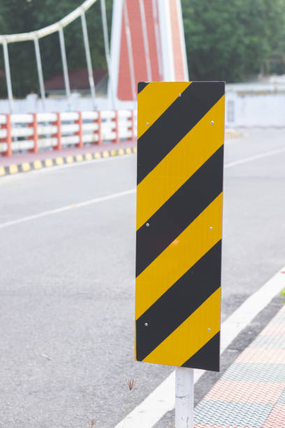 istock yellow and black caution board in the road 1333313089