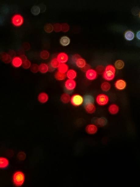 Blur Effect Of Red Lights At Night Stock Photo - Download Image