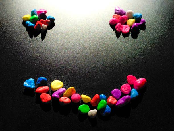 istock Smile-Shaped on colorful stone texture background.Selective focus 1333314567
