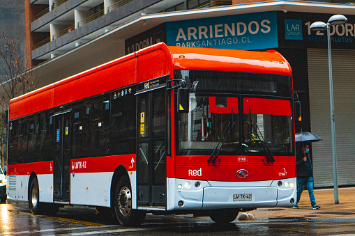 Santiago, Chile - June 2021: A Transantiago public transport bus in downtown Santiago during a week day. This bus is part of the Transantiago public transport system, which covers Santiago and includes the Subway since 2007