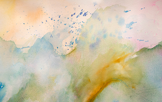 Colorful watercolor background with textures and splashes on white watercolor paper.  Blue  green brown yellow. My own work.
