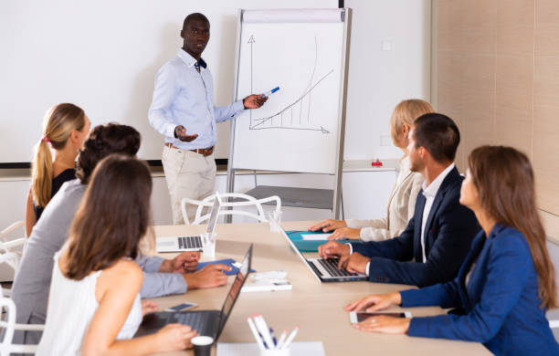 istock African man presenting business project to coworkers 1333322166