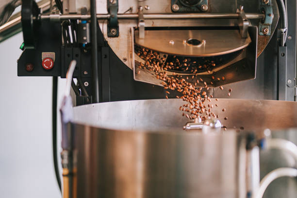 istock coffee roaster machine de-stoning roasted coffee bean flowing into cooling plate 1333323878
