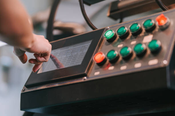 istock close up Asian chinese worker operating control panel touch screen on coffee roaster machinery preparing for coffee roasting process 1333324008