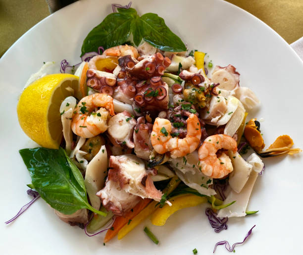Fresh mediterranean seafood salad. Top view seafood summer salad Fresh mediterranean seafood salad. Top view seafood summer salad fish food stock pictures, royalty-free photos & images