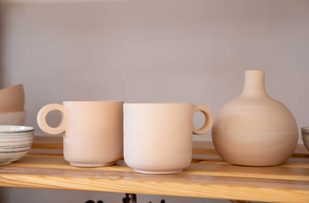istock Handmade Ceramic Pottery. White, not painted clay pottery. Creative studio potter. 1333325949