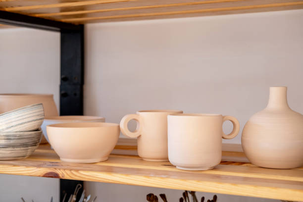 istock Handmade Ceramic Pottery. White, not painted clay pottery. Creative studio potter. 1333326473