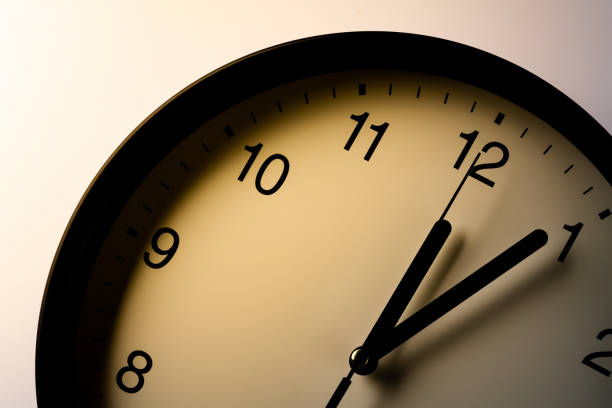 istock Clock showing the time around 12:00 1333328693