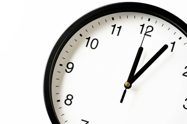 istock Clock showing the time around 12:00 1333328711