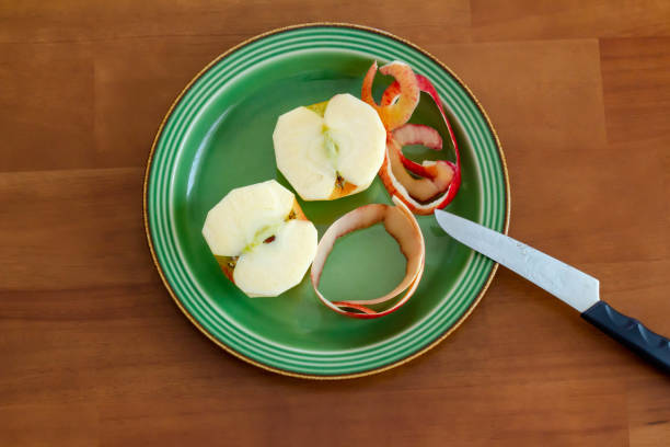 istock Peeled apples placed on a green flat plate 1333329287