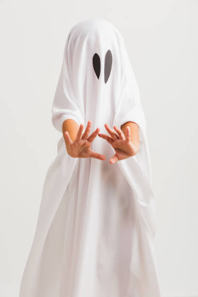 istock little cute child with white dressed costume halloween ghost scary 1333331005
