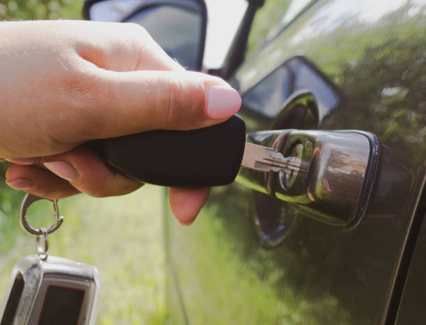 istock girl opens the car with a key close-up 1333332393