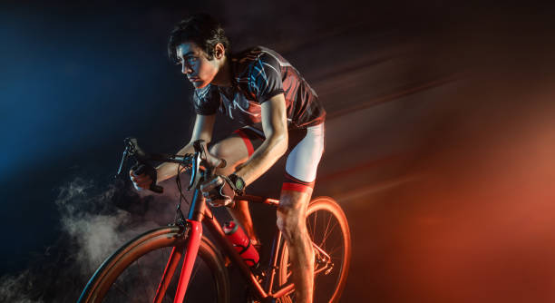 istock Sport. Athlete cyclists in silhouettes on dark background 1333332957