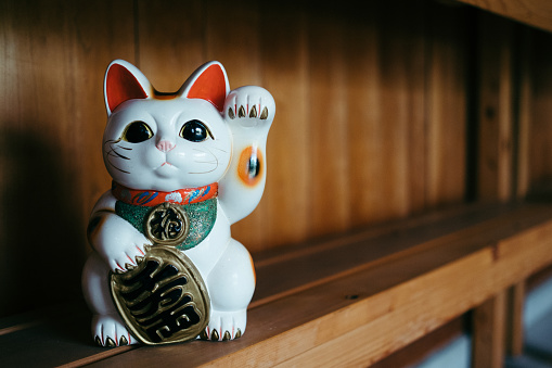 This is Maneki-neko which is known as Lucky Cat.