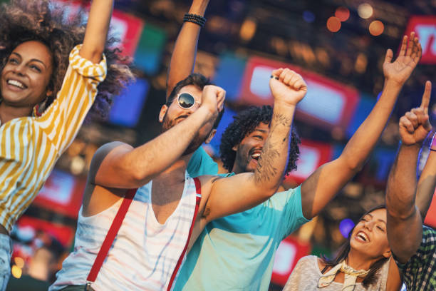istock Group of friends dancing at a concert. 1333336578